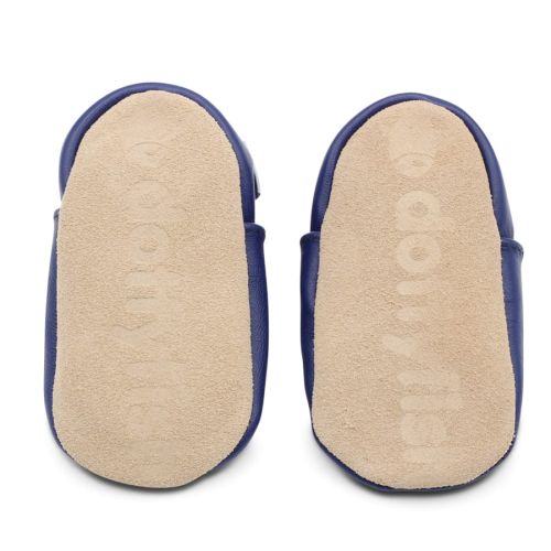 Soft suede non-slip sole of Dotty Fish infant shoes imprinted with Dotty Fish name and logo.