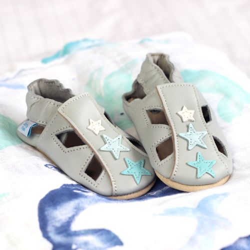 Grey leather sandals with blue stars.