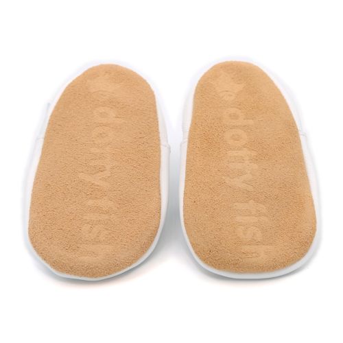 Soft suede non-slip sole of Dotty Fish infant shoes imprinted with Dotty Fish name and logo.