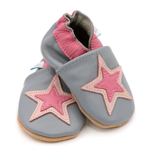 Dotty Fish grey leather soft sole infant girl’s barefoot shoes with pink ankle trim and pink star design.