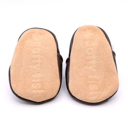 Non-slip soft suede soles of Dotty Fish pre-walker shoes imprinted with Dotty Fish name and logo.