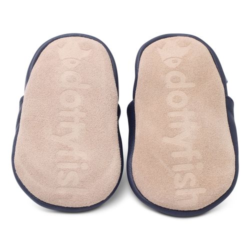 Soft suede non-slip sole of Dotty Fish infant shoes imprinted with Dotty Fish name and logo.