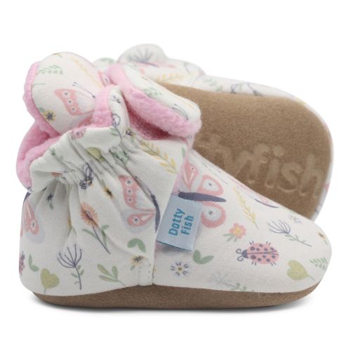 Cream cotton baby booties, with pink fleece lining and floral pattern.
