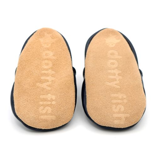 Non-slip soft suede soles of Dotty Fish pre-walker shoes imprinted with Dotty Fish name and logo.