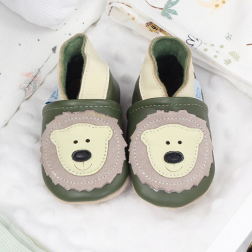 Leather bear shoes, in drawer with baby blankets.