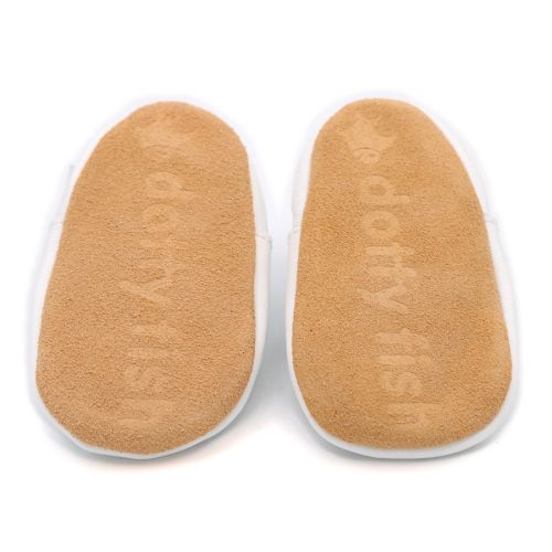 Non-slip soft suede soles of Dotty Fish pre-walker shoes imprinted with Dotty Fish name and logo.