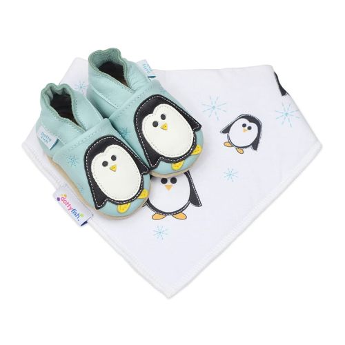 Mint green Dotty Fish soft sole shoes with black and white penguin design, with a matching white bib with penguin pattern.