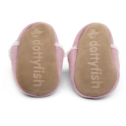Soft suede non-slip sole of Dotty Fish infant slippers imprinted with Dotty Fish name and logo.