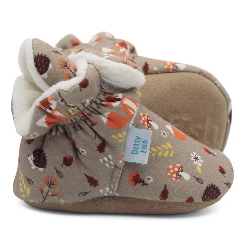 Light brown cotton Dotty Fish baby soft sole booties with white fleece lining and fox and hedgehog woodland pattern.