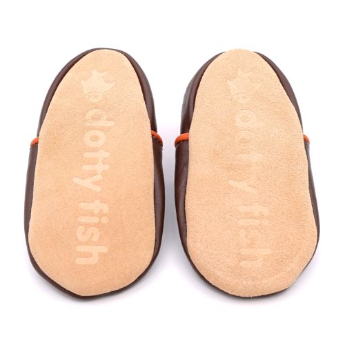 Non-slip soft suede soles of Dotty Fish pre-walker shoes imprinted with Dotty Fish name and logo.