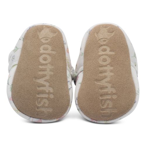 Soft suede soles of baby booties, imprinted with Dotty Fish logo.