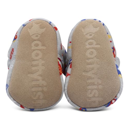 Suede soles of cotton baby booties, imprinted with Dotty Fish logo.