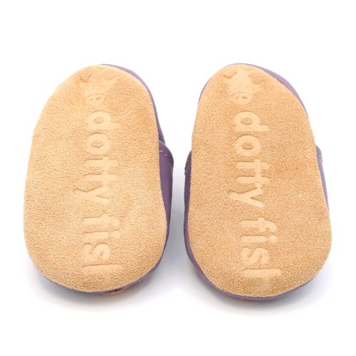 Soft suede non-slip sole of Dotty Fish infant shoes imprinted with Dotty Fish name and logo.