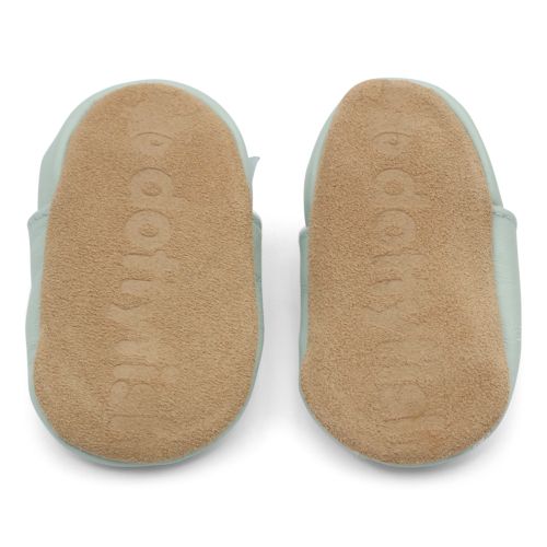 Non-slip soft suede soles of Dotty Fish pre-walker shoes imprinted with Dotty Fish name and logo.