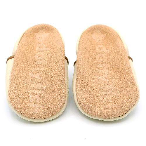 Soft suede non-slip sole of Dotty Fish shoes, imprinted with Dotty Fish name and logo.