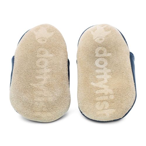 Soft suede non-slip sole of Dotty Fish infant shoes imprinted with Dotty Fish name and logo.