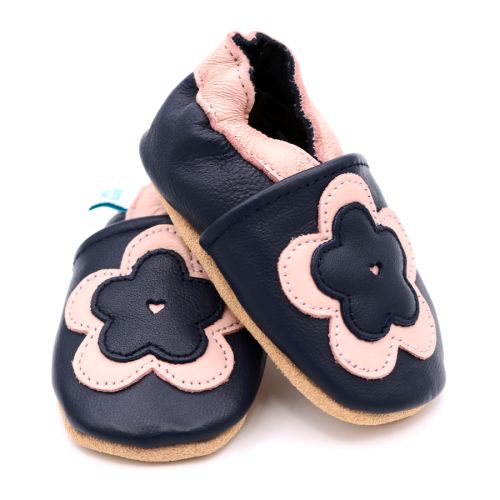 Dotty Fish navy leather soft sole infant girl’s barefoot shoes with pink ankle trim and pink and navy flower.