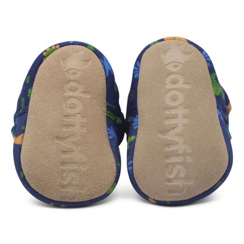 Soft suede soles of baby booties, imprinted with Dotty Fish logo.