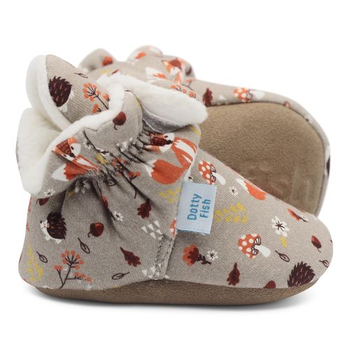 Light brown cotton baby booties with cream fleece lining and woodland pattern.