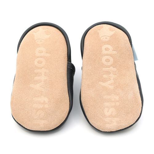 Soft suede non-slip sole of Dotty Fish infant shoes imprinted with Dotty Fish name and logo.