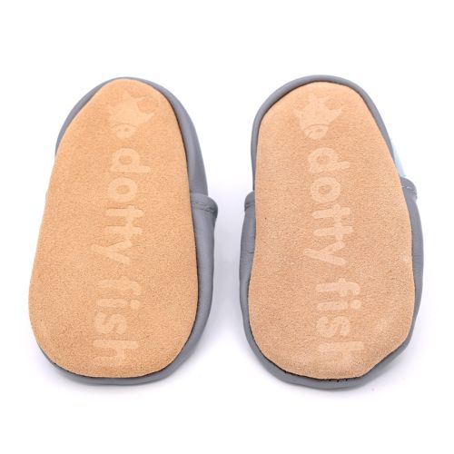 Non-slip soft suede soles of Dotty Fish pre-walker shoes imprinted with Dotty Fish name and logo.