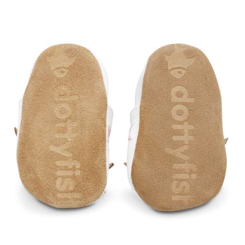 Soft suede non-slip sole of Dotty Fish infant shoes imprinted with Dotty Fish name and logo.