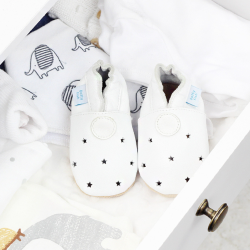 White leather baby shoes with cut-out stars from Dotty Fish.